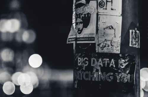 a pole with a bunch of stickers on it